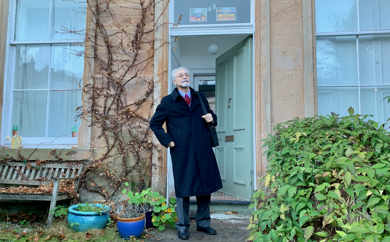 Mario Caffero, South American activist at COP26, standing in doorway