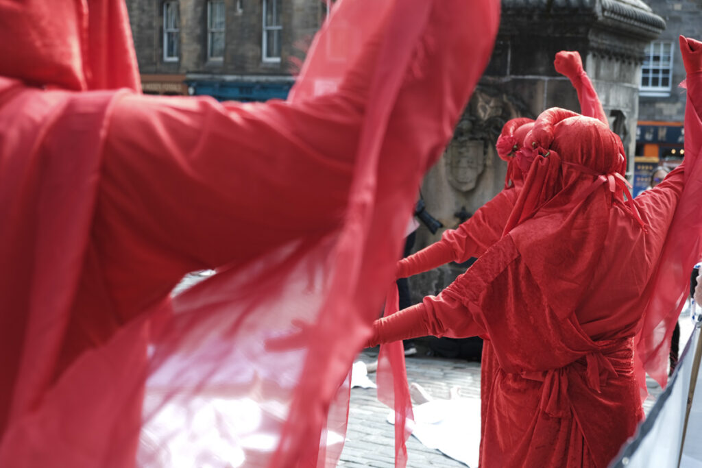 Close up of XR Die-In participants clothed in red